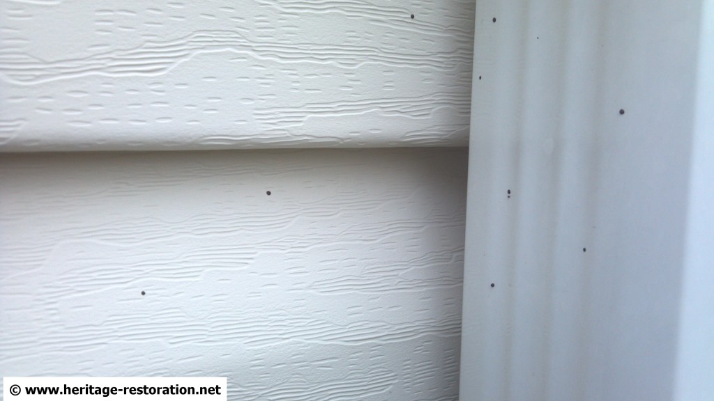 What are these little black spots on my house? Heritage Pressure Washing